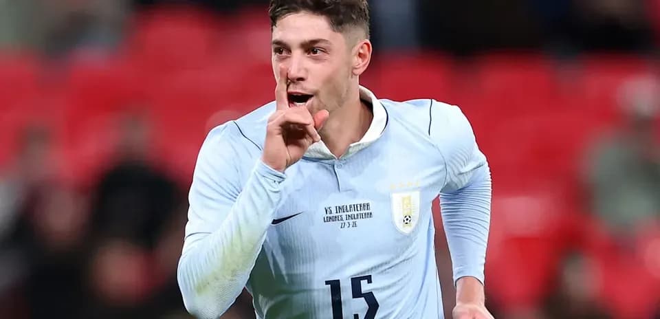 Player celebrating with a shushing gesture during match