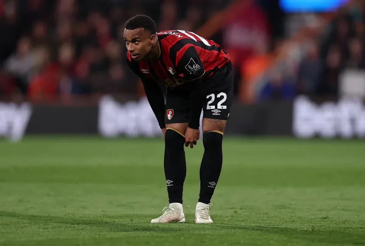 Bournemouth player bending down on the pitch