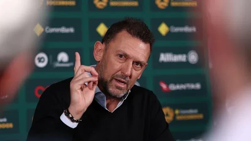 Men's football manager speaking at press conference