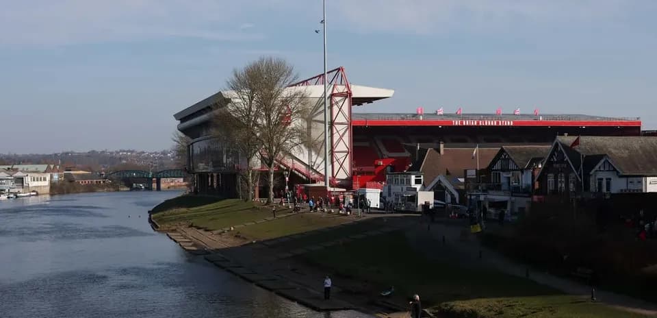The City Ground stadium by the river with spectators