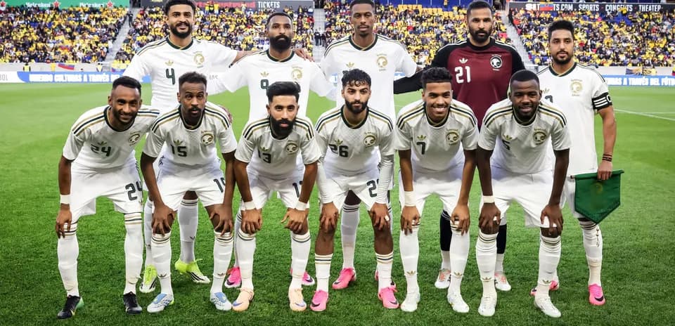 Football team posing for photo before match