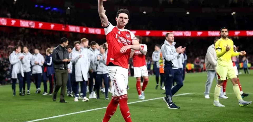 Arsenal player waving to fans after match