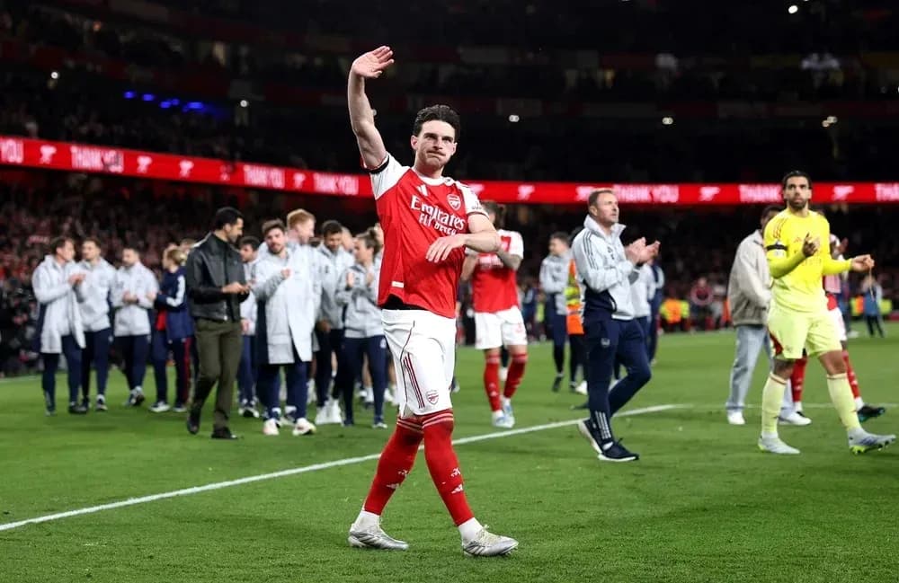 Arsenal player waving to fans after match