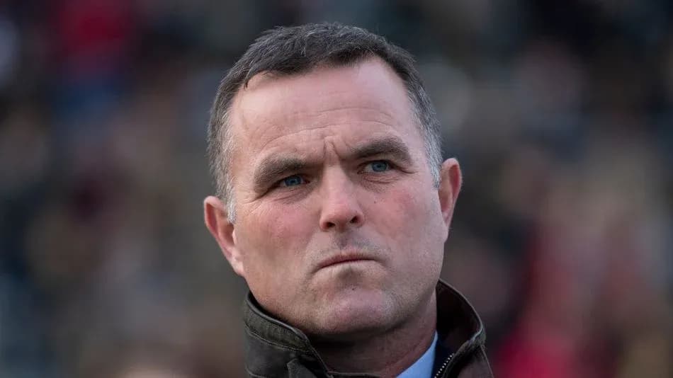A man looking serious in a crowd
