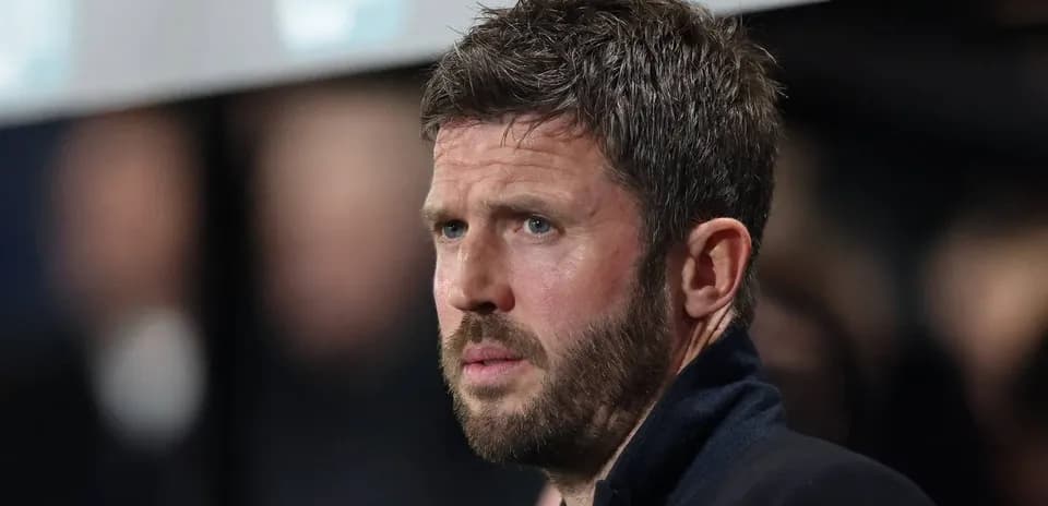 Football coach observing match from sidelines