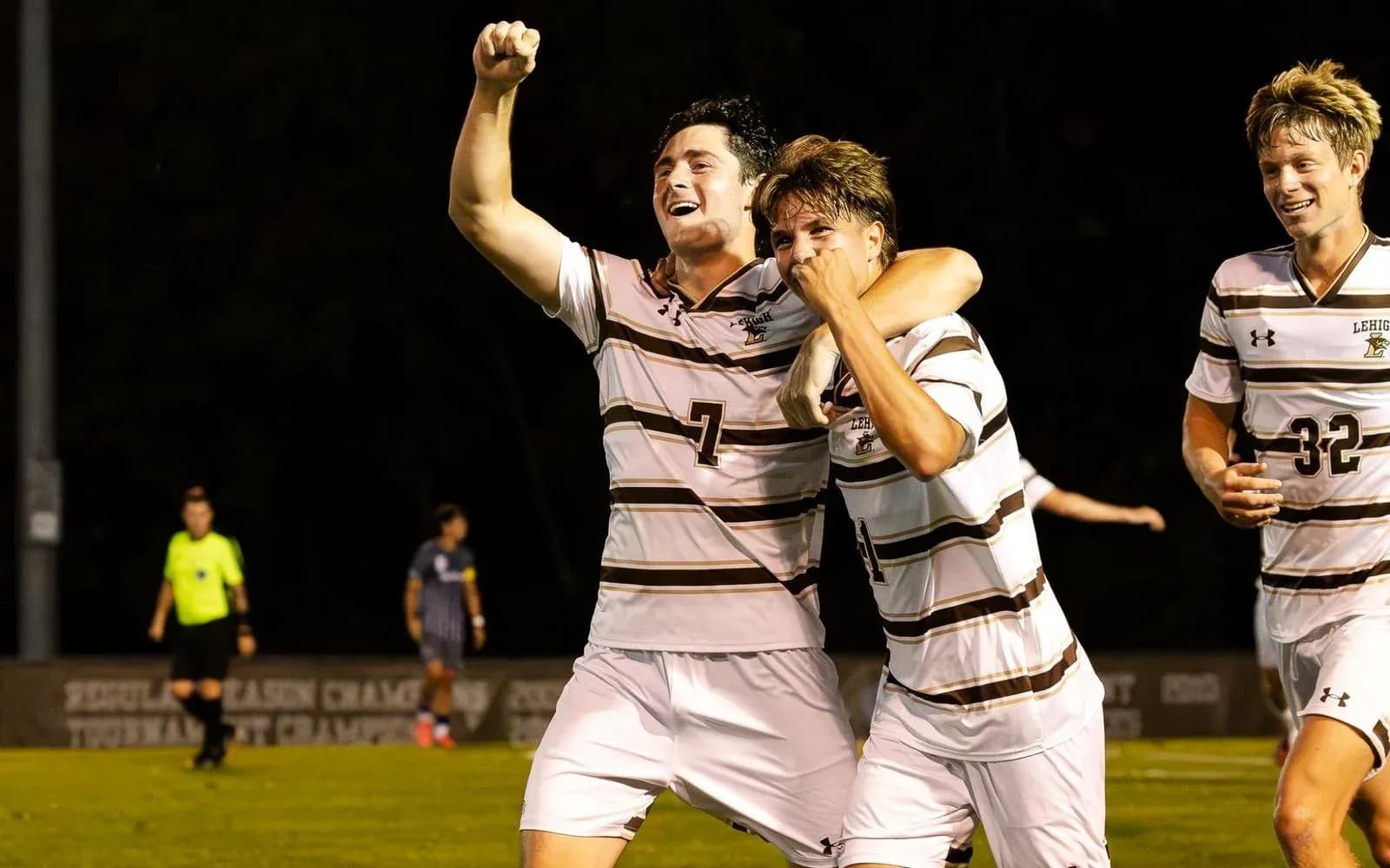 Lehigh players celebrating a goal on the field