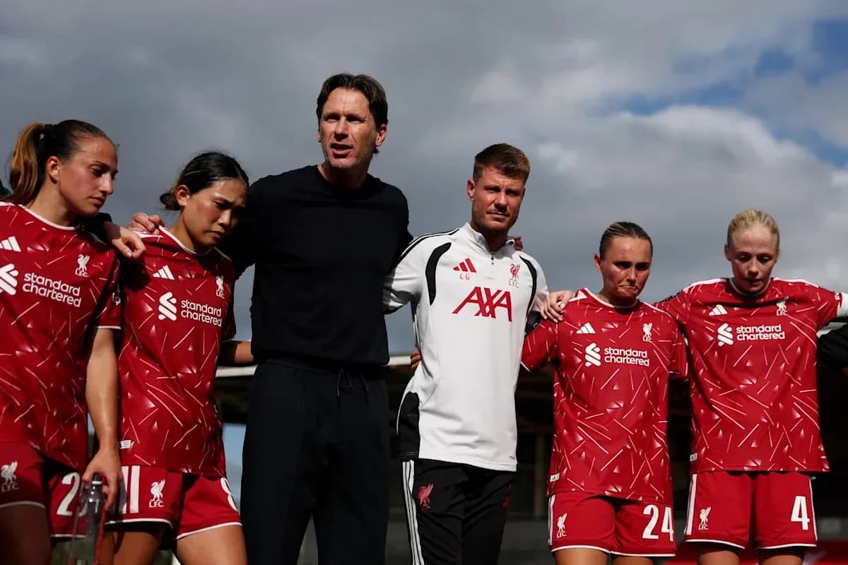 Liverpool women's team in huddle with coaches