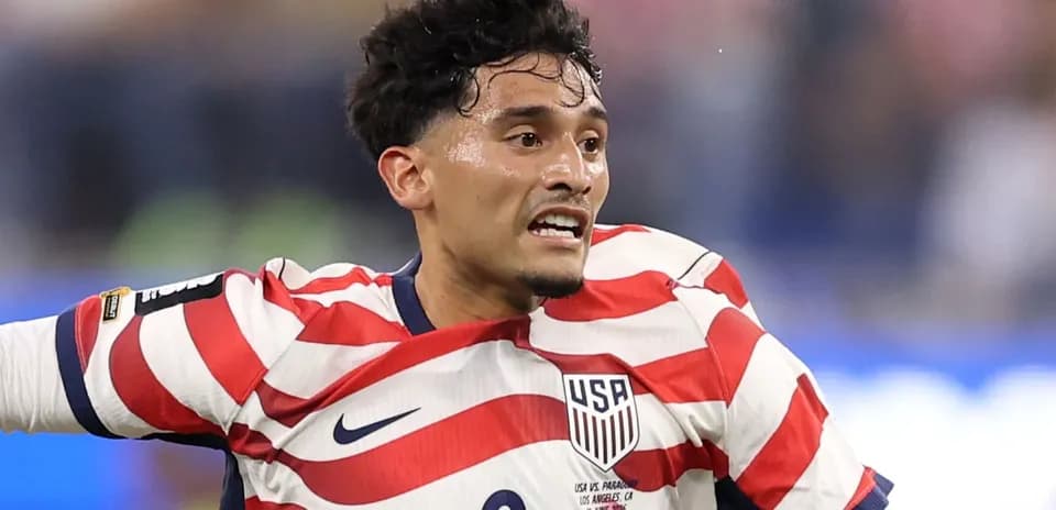 USA player in striped jersey during match action