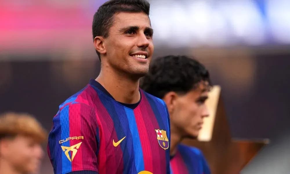 Barcelona player smiling during trophy presentation ceremony