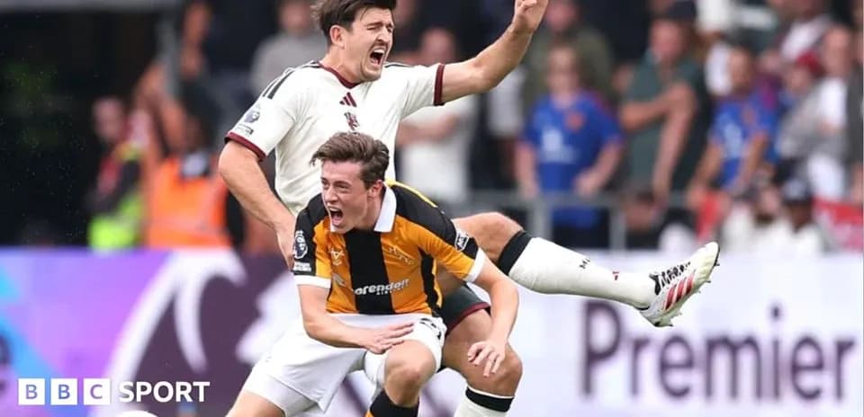 Two players contesting during a football match