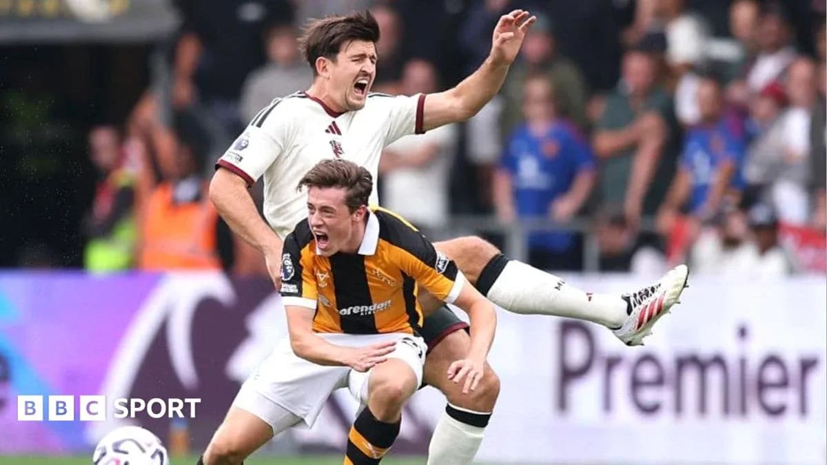 Two players contesting during a football match
