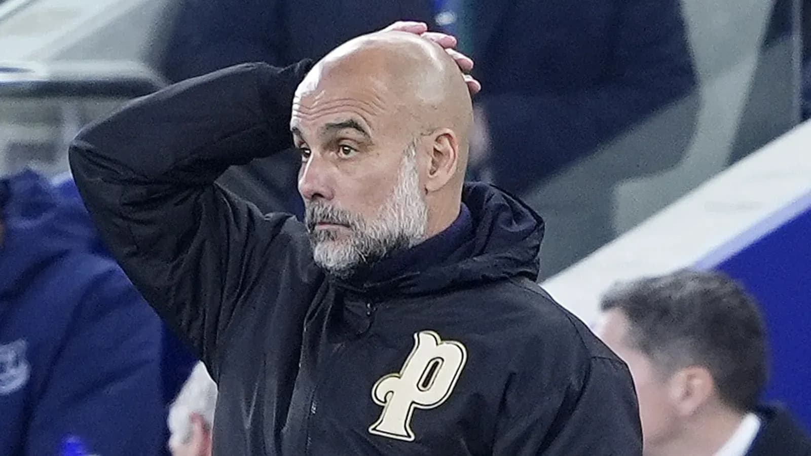 Football manager observing the match from sidelines
