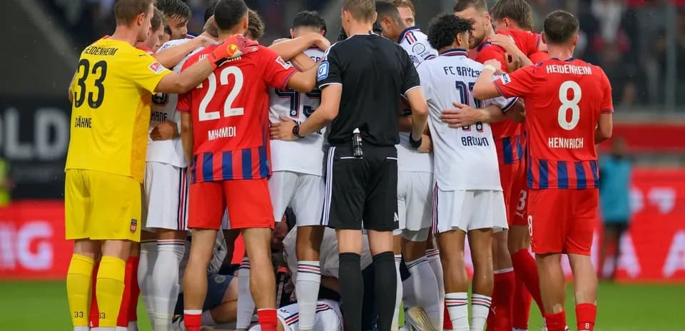Players from both teams huddled during match incident