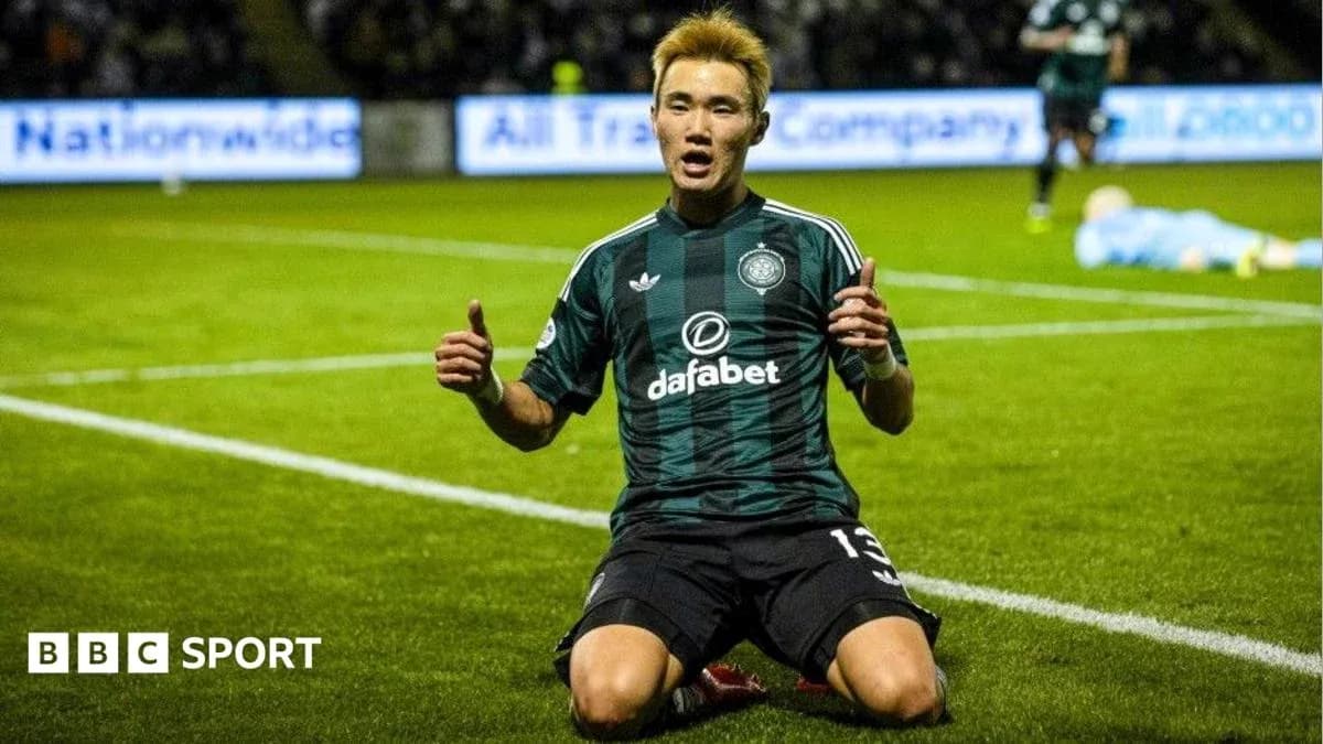 Player celebrating after scoring a goal on pitch