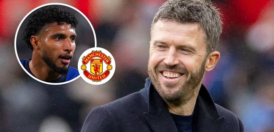 Michael Carrick smiling with Manchester United logo