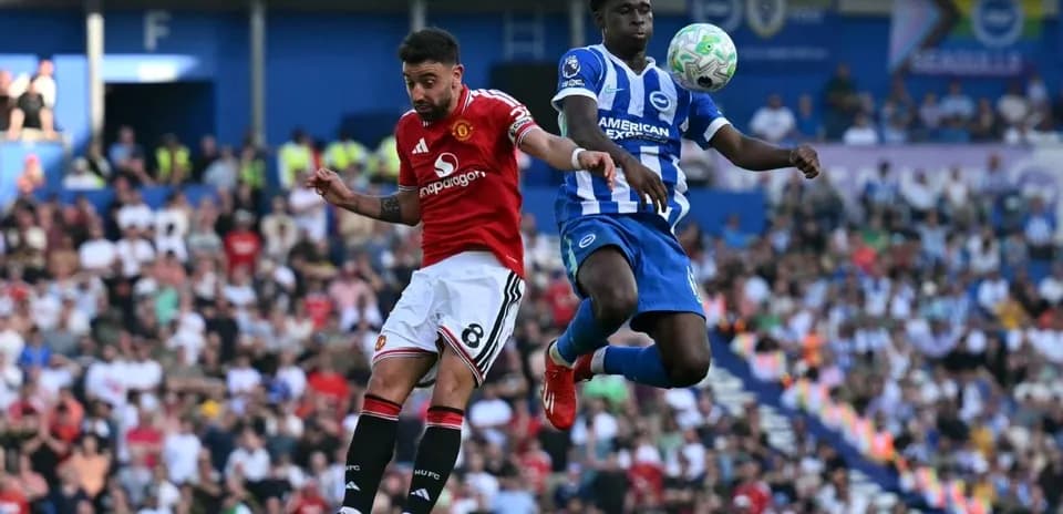 Two players competing for the ball during match