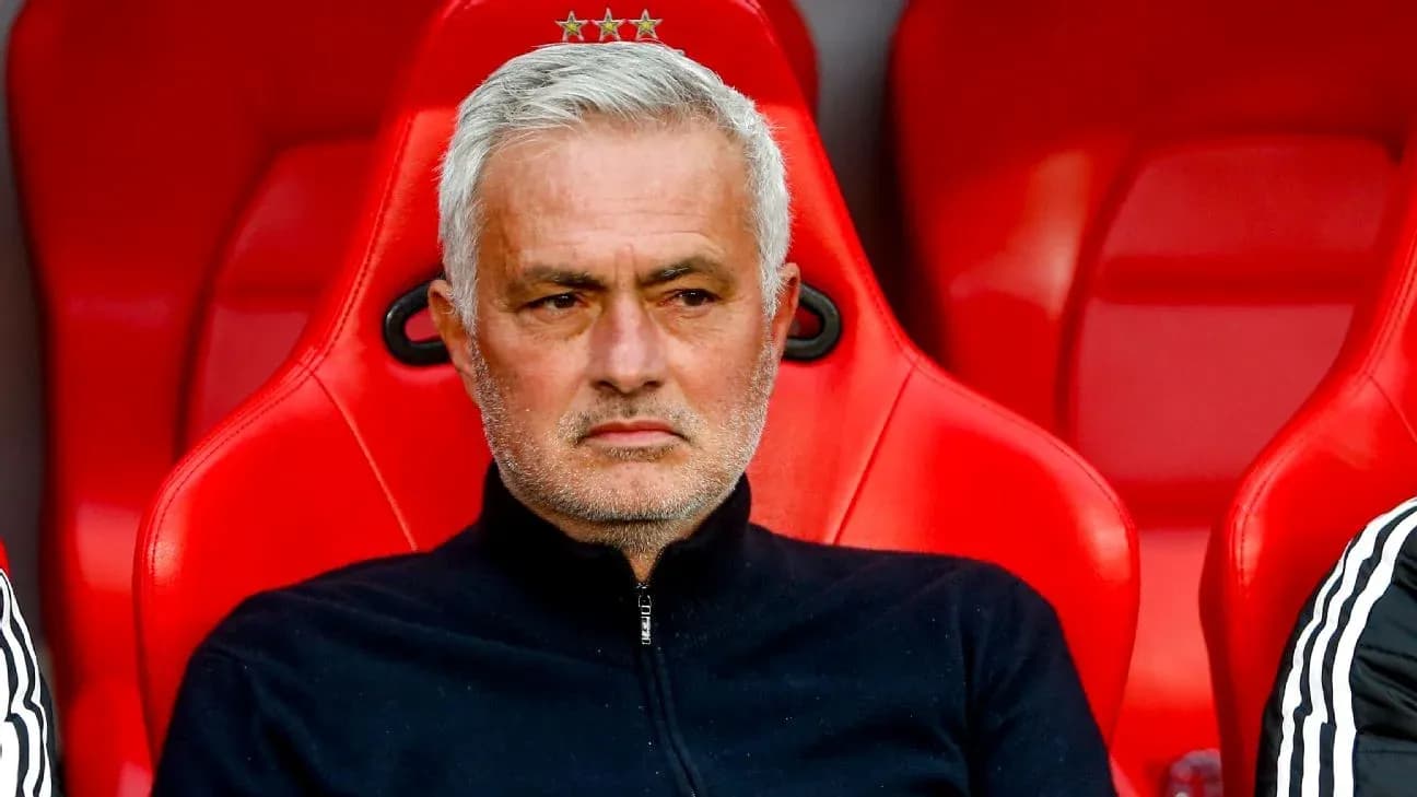 Head coach sitting on bench during match