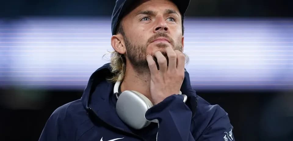 Player pondering during a match at the stadium