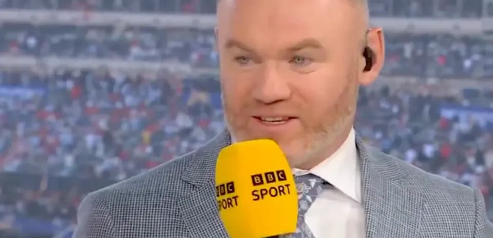 Analyst speaking with microphone during sports broadcast