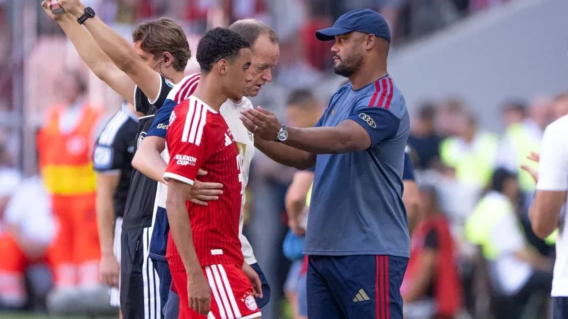 Coach discussing with player during match substitution