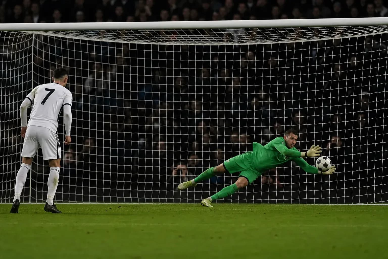 Goalkeeper diving to save a penalty kick