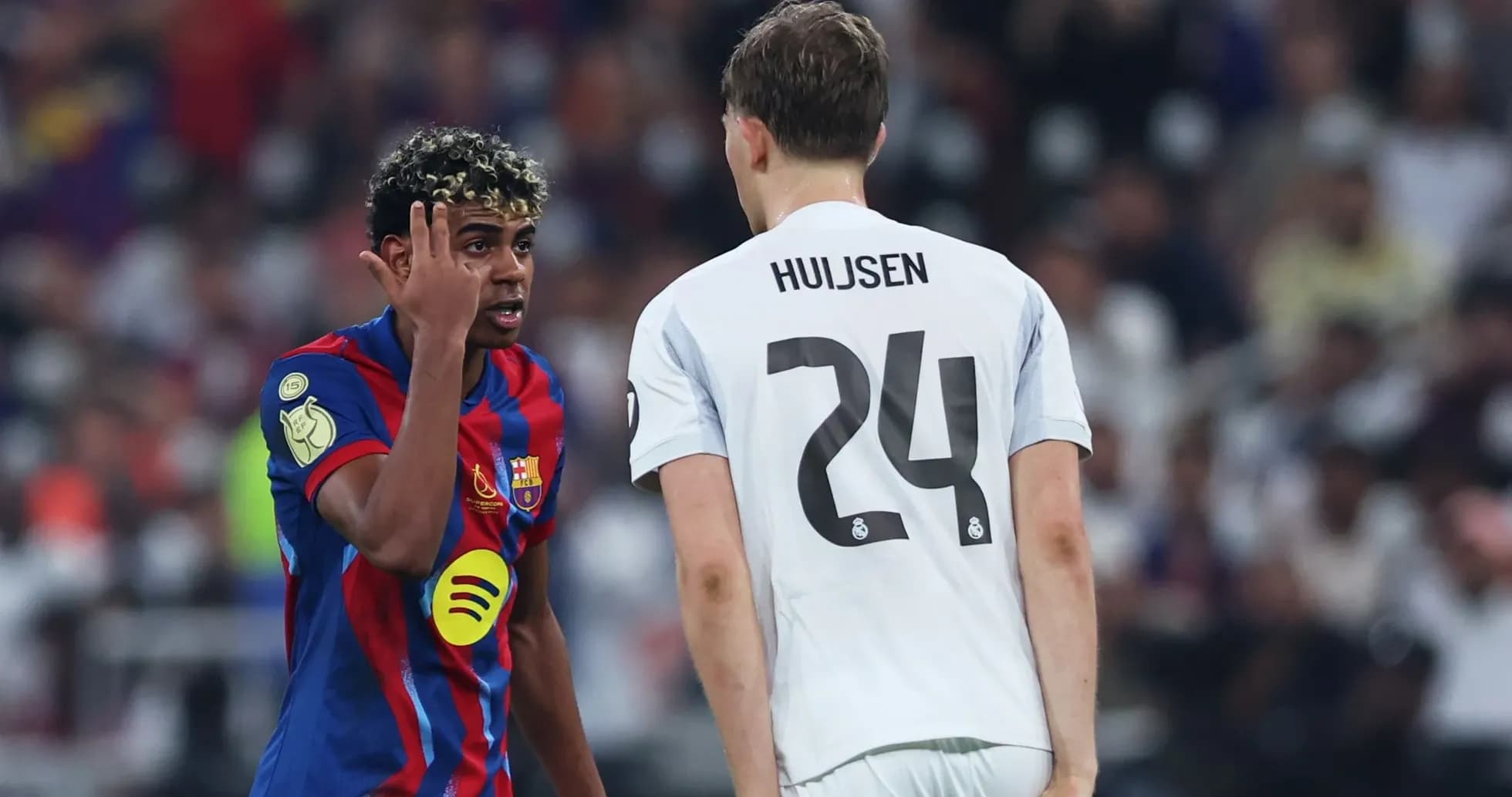 Barcelona player talking to opponent during match
