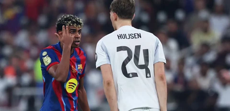 Barcelona player talking to opponent during match