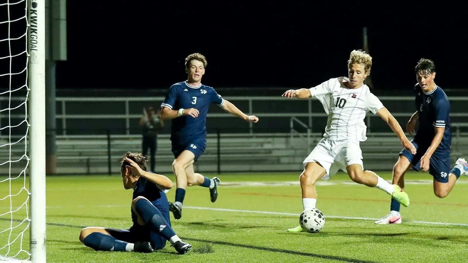 Player attempting to score while defenders react