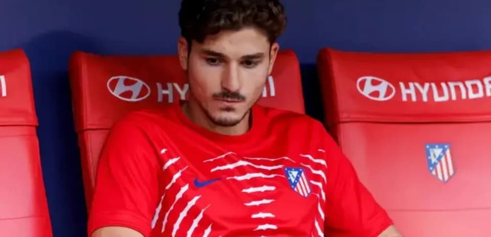 Player sitting on bench during match