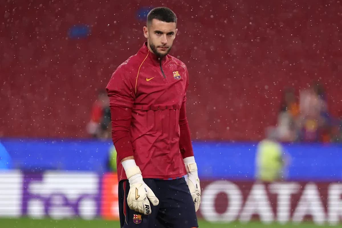 Goalkeeper in training kit at stadium during rain Goalkeeper in training kit at stadium during rain