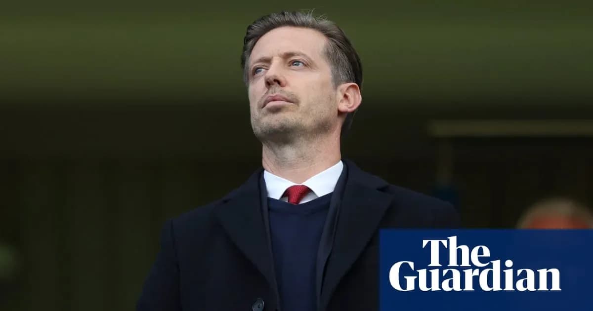 Men's football manager observing from the sidelines Men's football manager observing from the sidelines