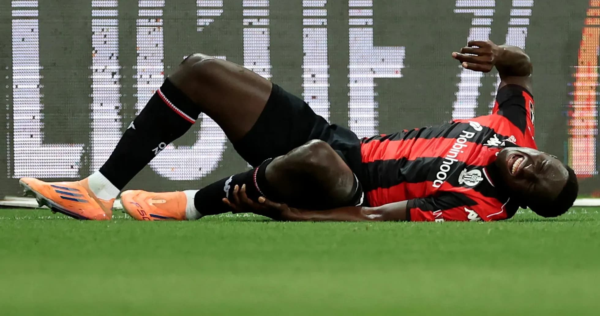 Player lying on ground after sustaining injury Player lying on ground after sustaining injury