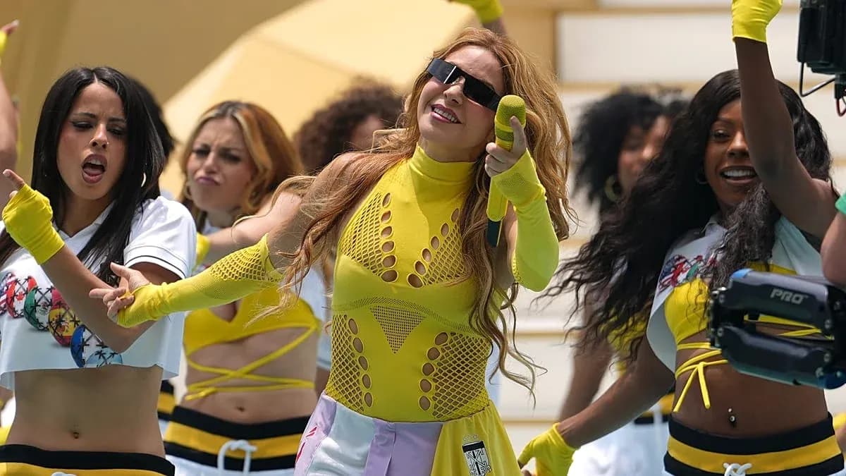 Dancers performing in colorful outfits during routine Dancers performing in colorful outfits during routine