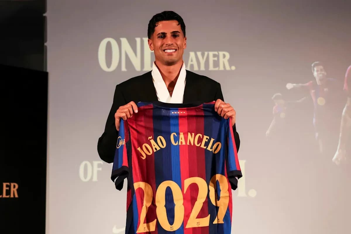 João Cancelo presenting Barcelona jersey at event João Cancelo presenting Barcelona jersey at event