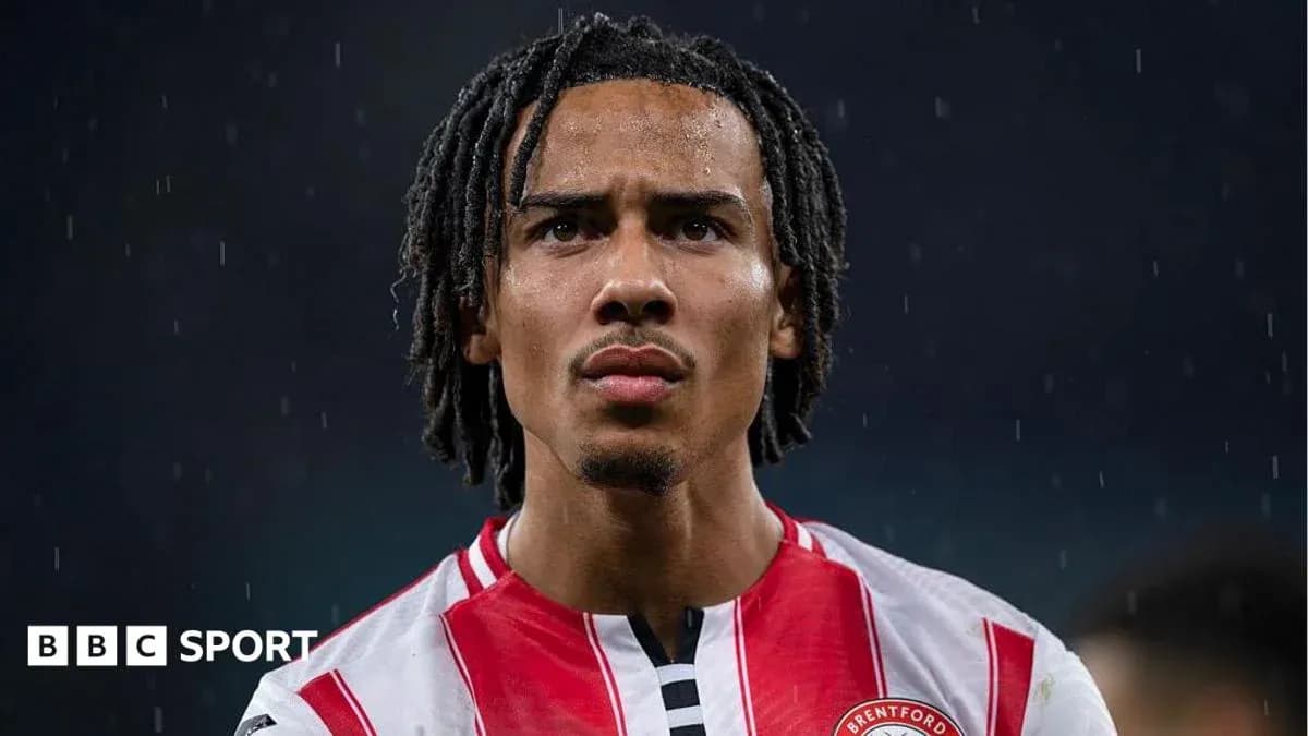 Brentford player focused during rainy match Brentford player focused during rainy match