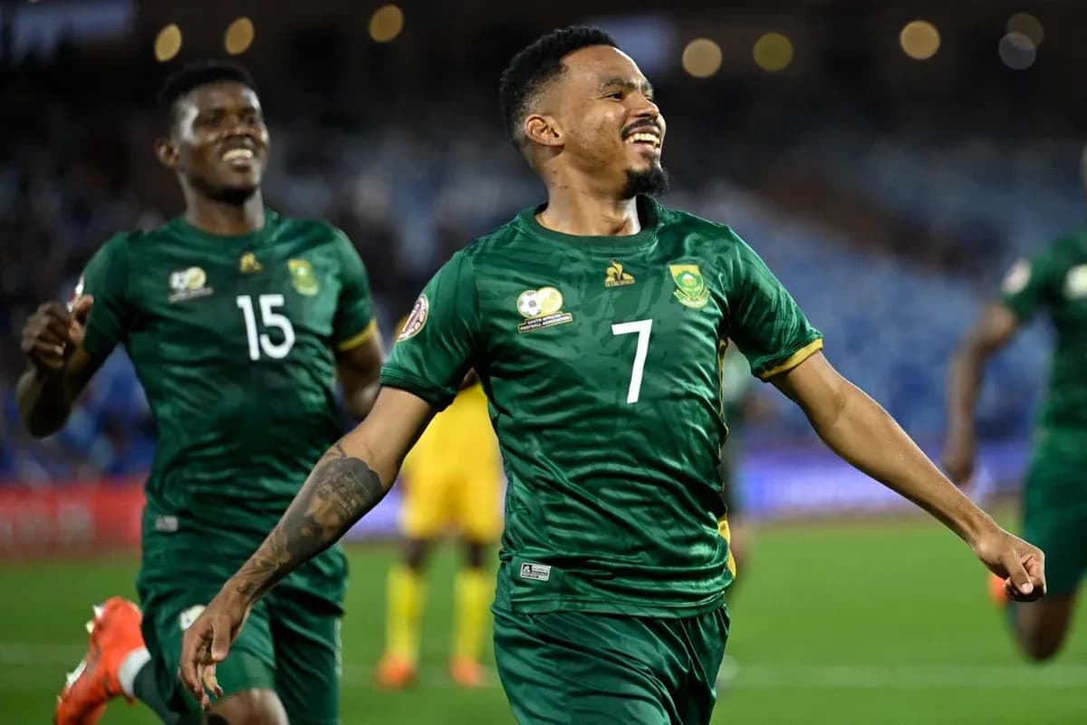 Two South African players celebrating a goal Two South African players celebrating a goal