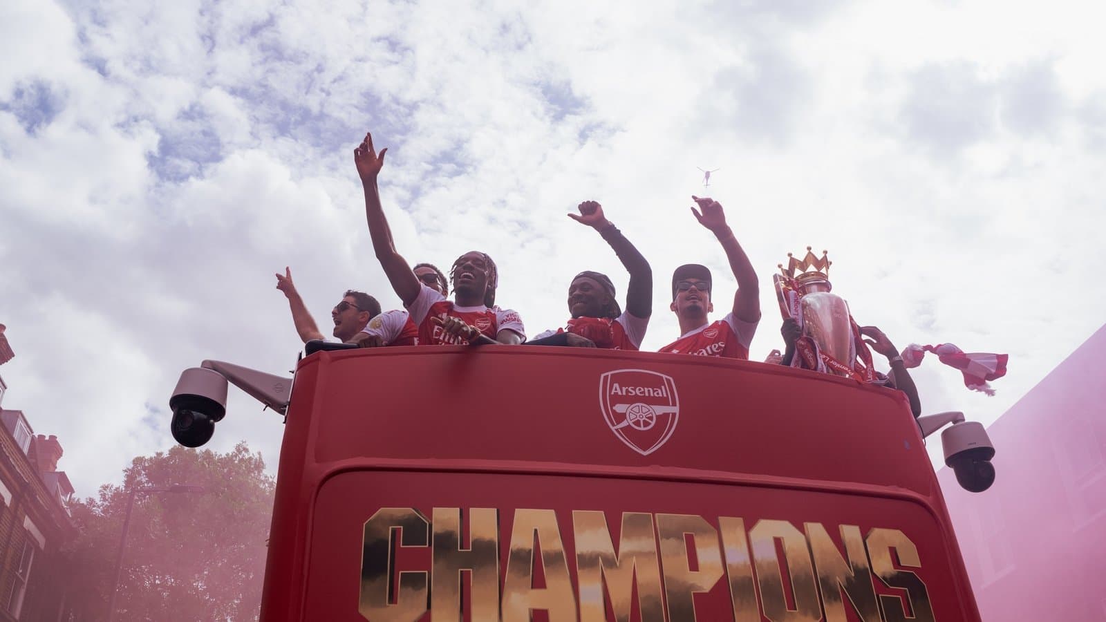 Arsenal players celebrating on victory parade bus Arsenal players celebrating on victory parade bus