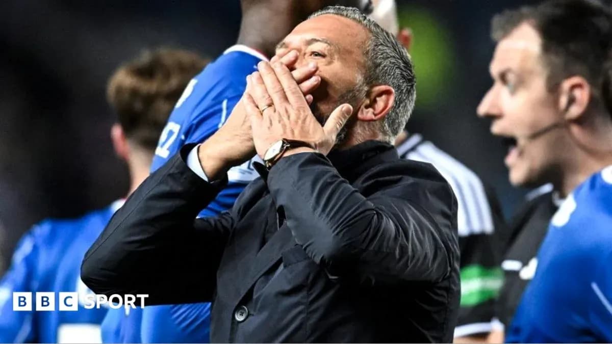Men's football manager reacting on the sidelines Men's football manager reacting on the sidelines
