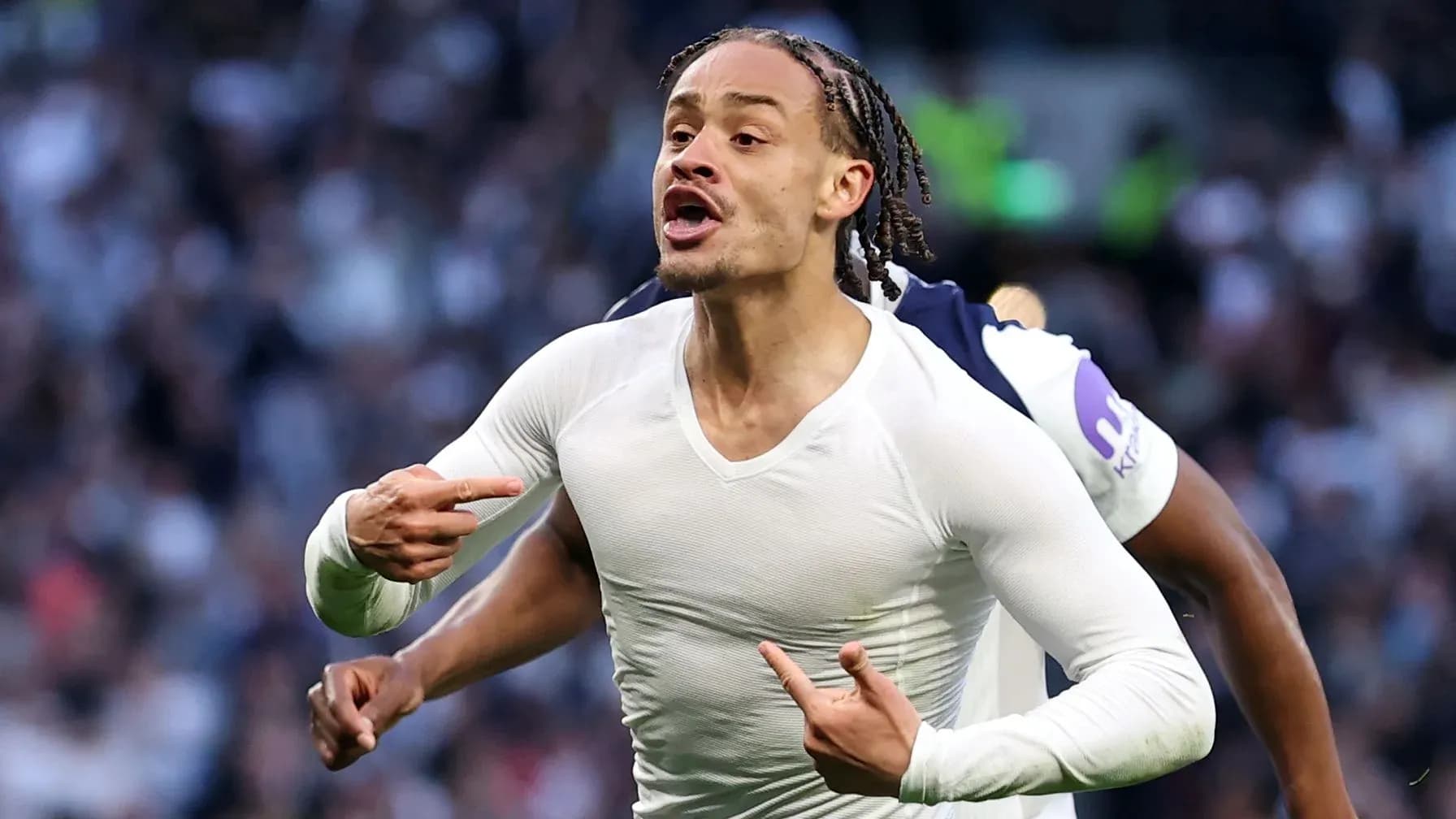 Player celebrating passionately after scoring a goal Player celebrating passionately after scoring a goal