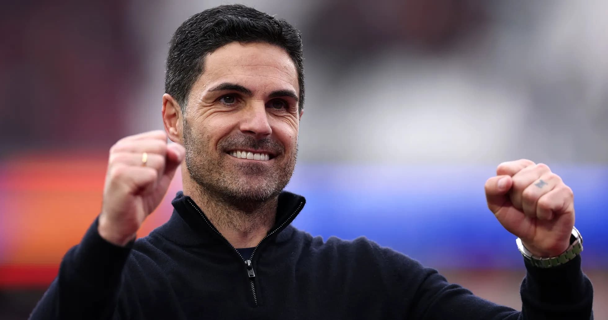 Football manager celebrating with clenched fist Football manager celebrating with clenched fist