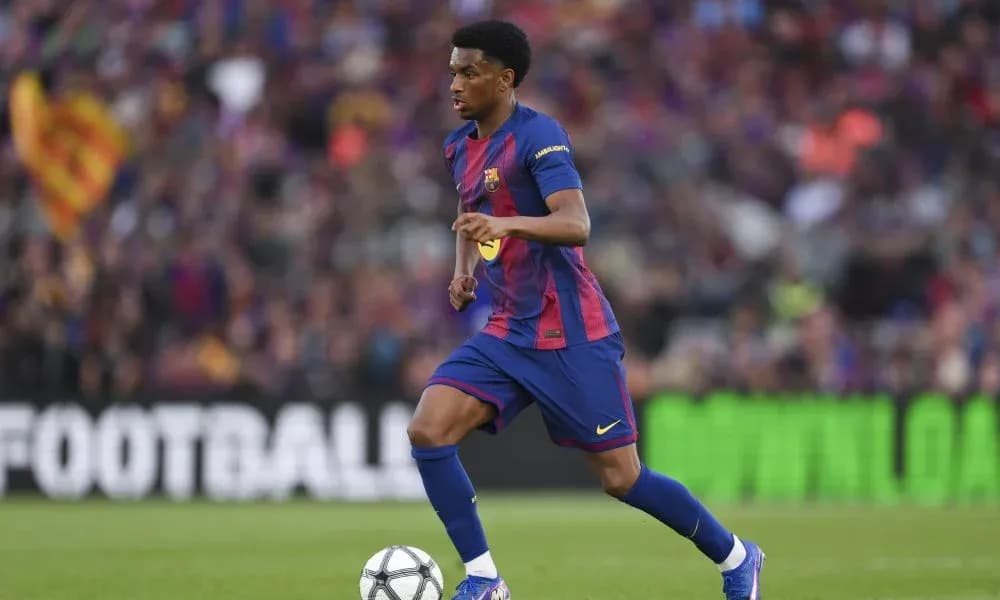 Barcelona player dribbling the ball on field Barcelona player dribbling the ball on field