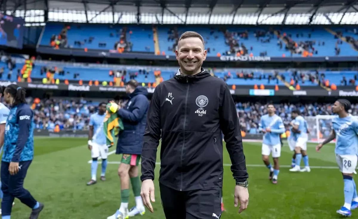 Manchester City staff celebrating after the match Manchester City staff celebrating after the match