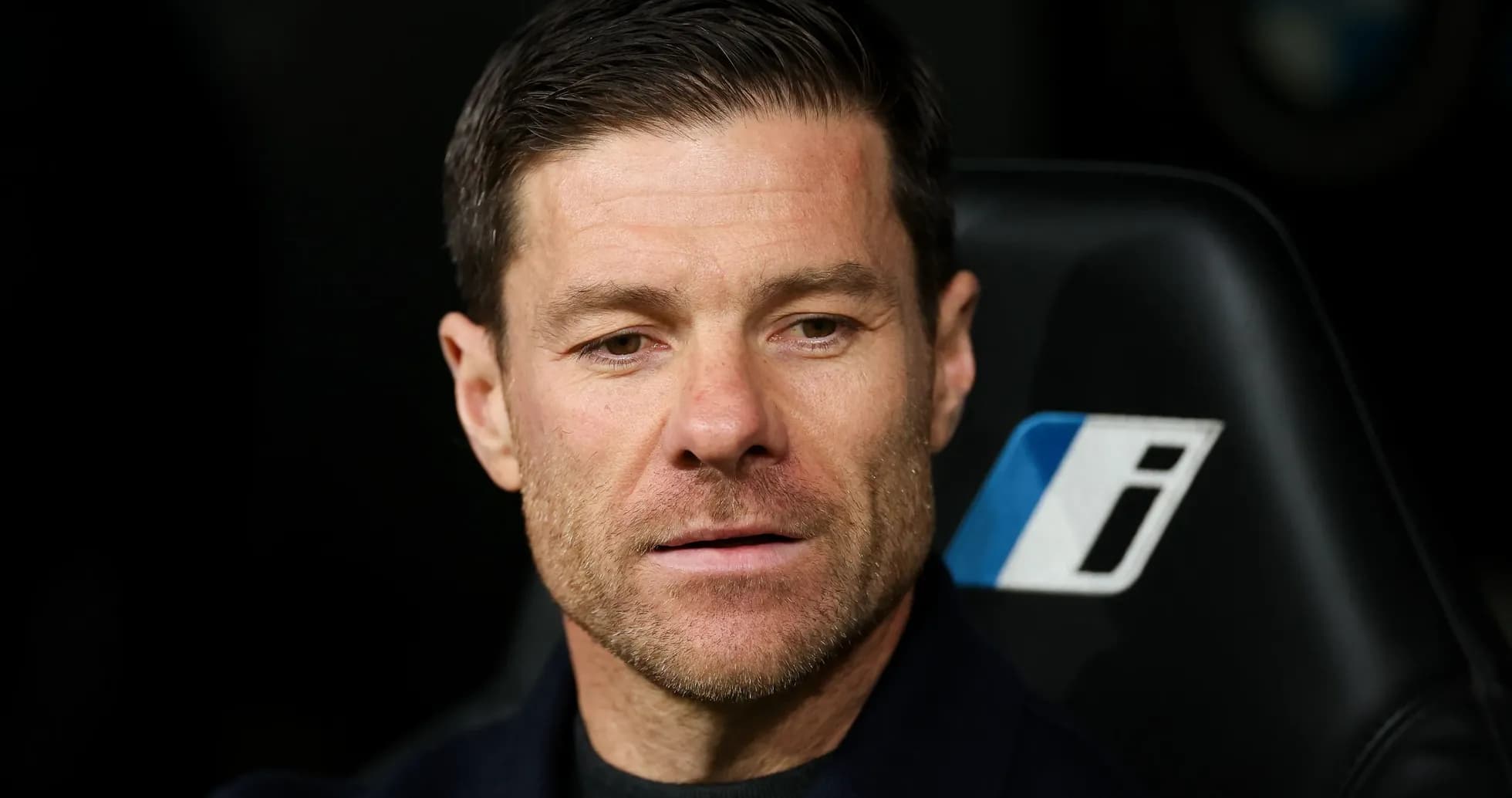 Manager seated on bench during match Manager seated on bench during match