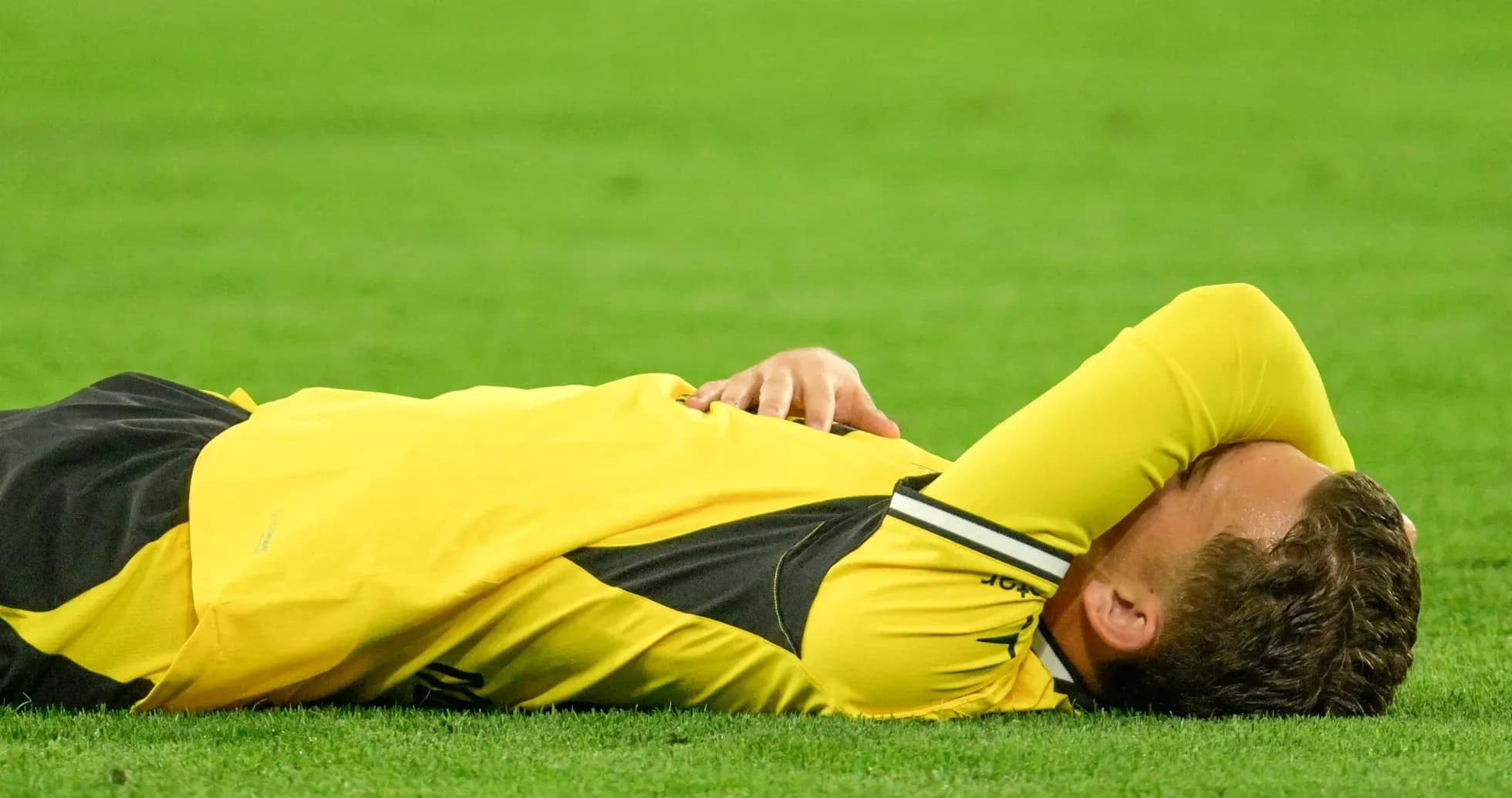 Player lying on the ground during match Player lying on the ground during match