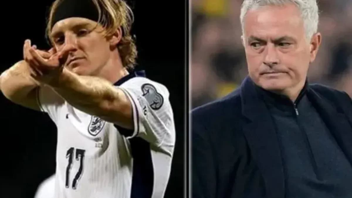 Football player celebrating goal alongside manager Football player celebrating goal alongside manager