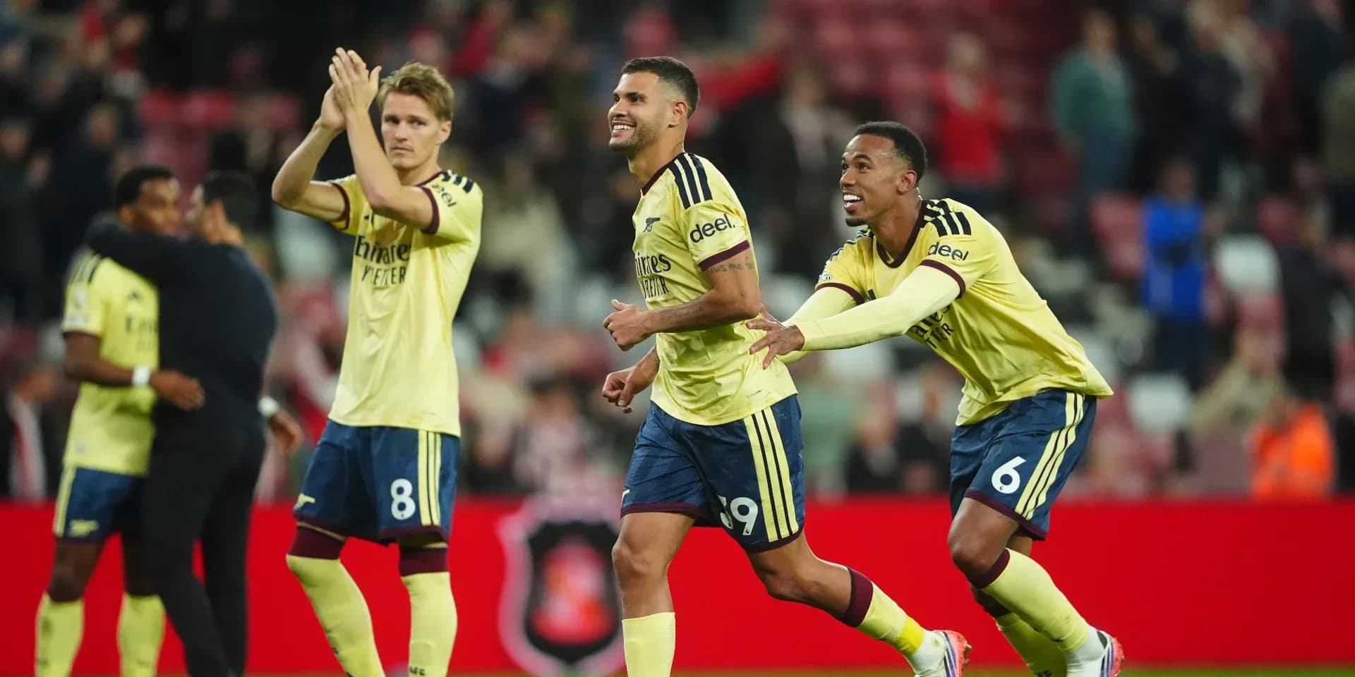 Arsenal players celebrating after a match victory Arsenal players celebrating after a match victory