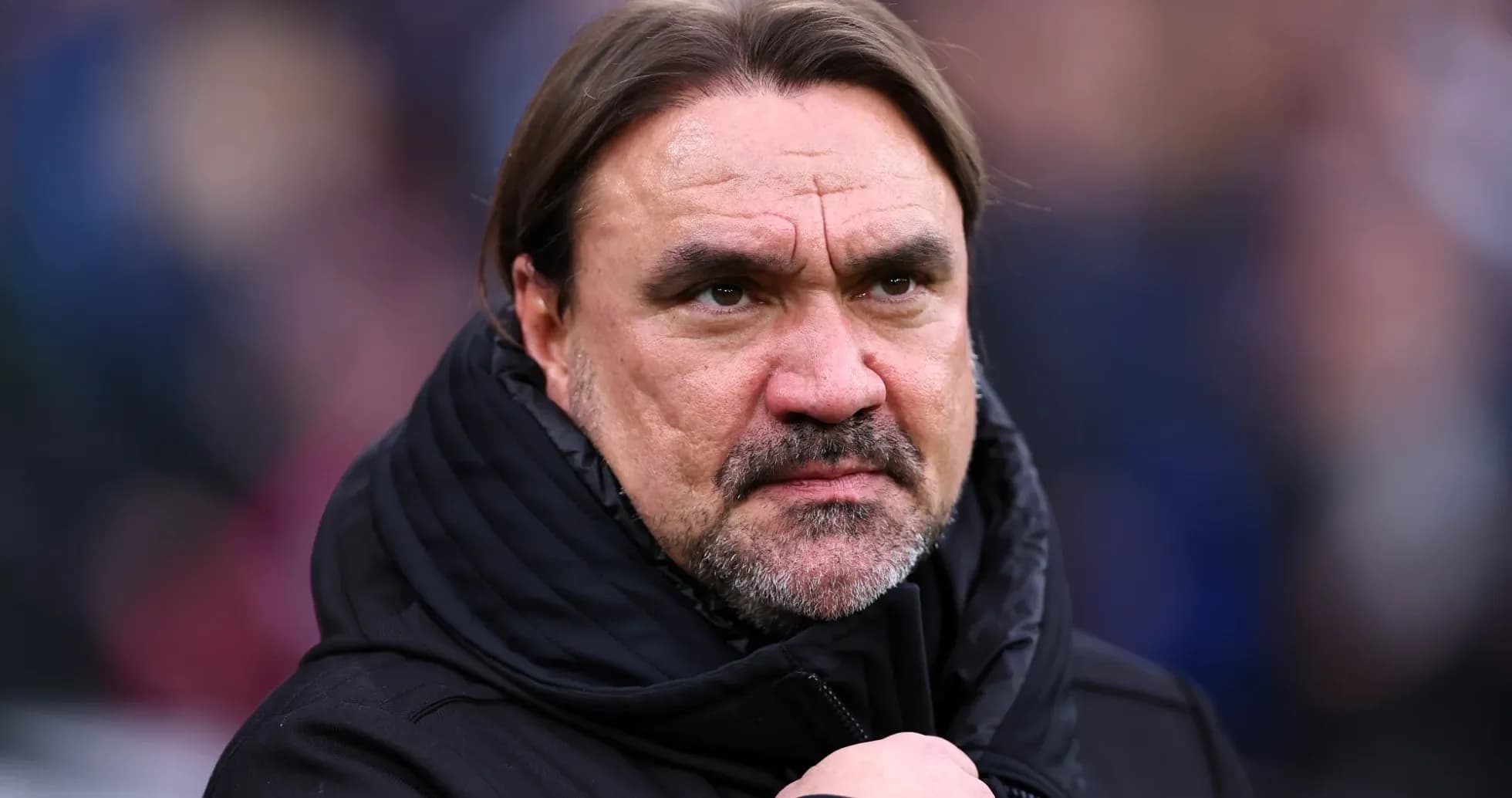 Football manager observing match from sidelines Football manager observing match from sidelines