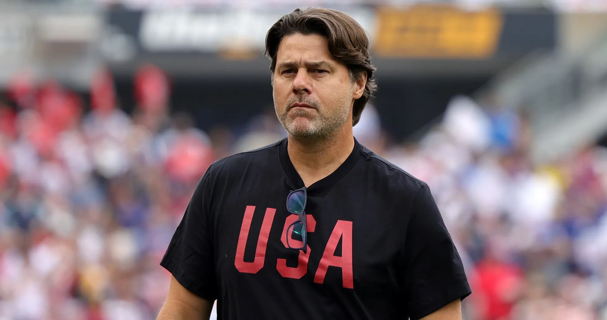 Coach wearing USA shirt on field during match Coach wearing USA shirt on field during match