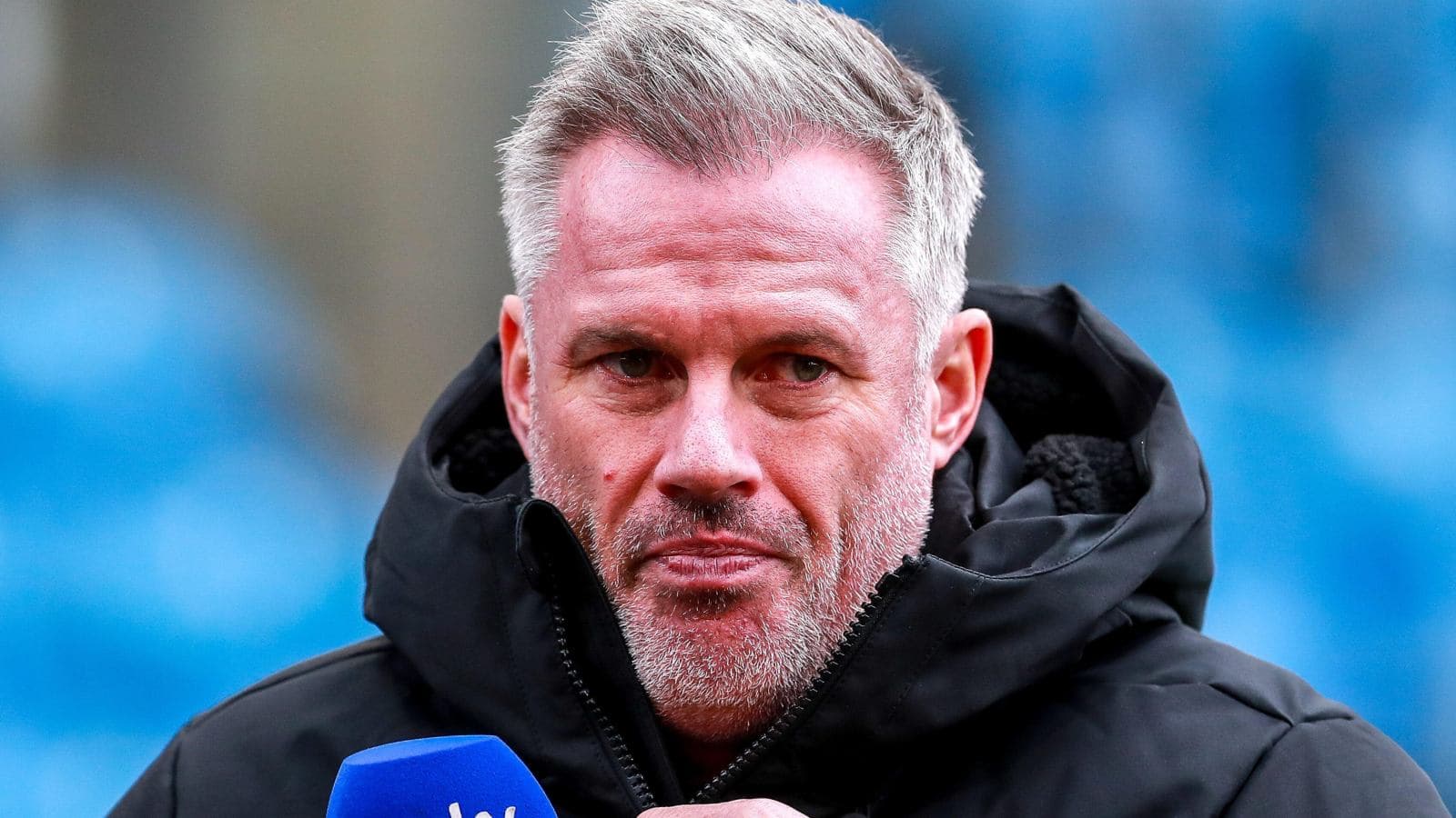 Analyst speaking into microphone at stadium Analyst speaking into microphone at stadium