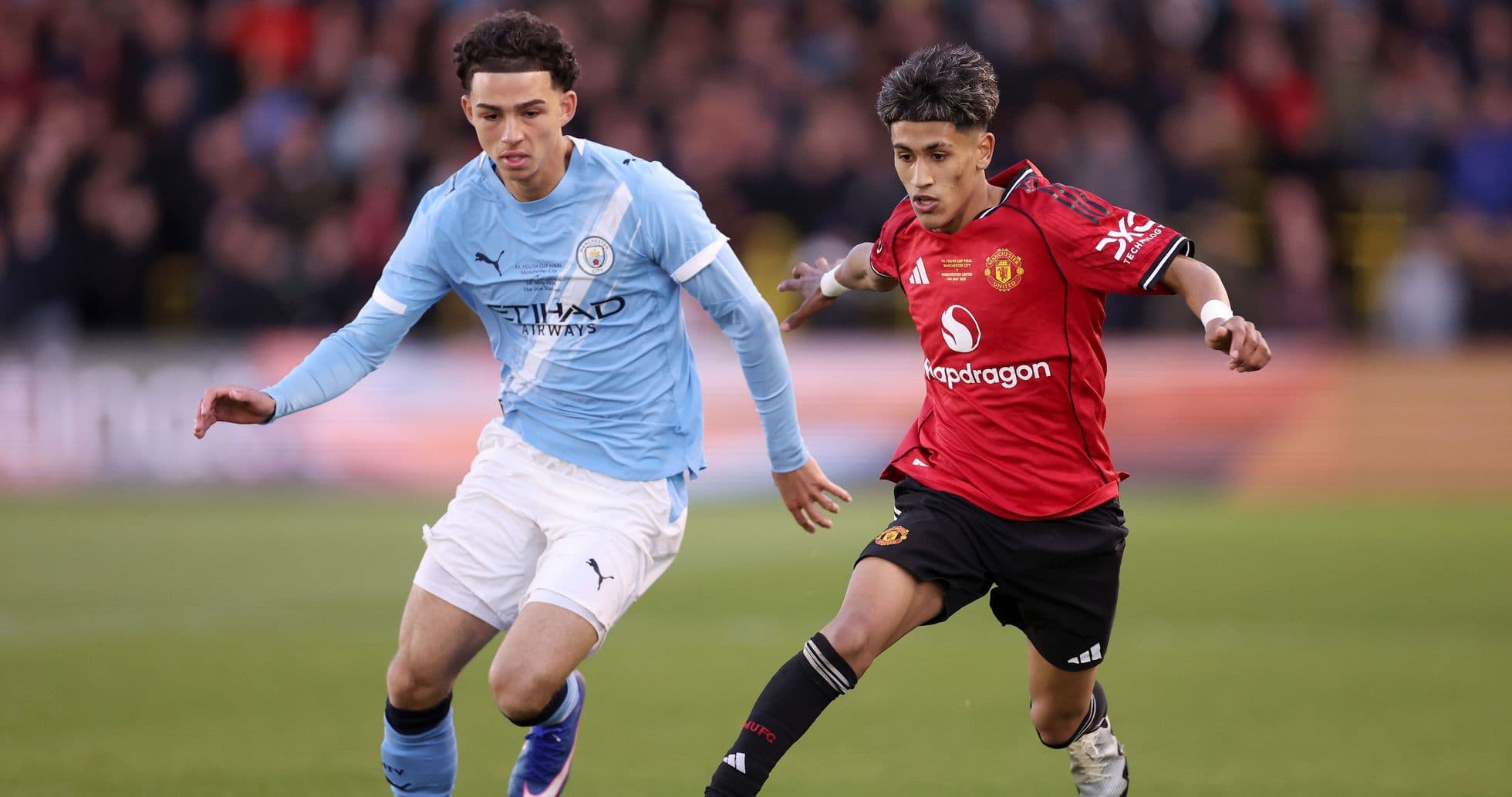 Manchester City and Manchester United players in action Manchester City and Manchester United players in action
